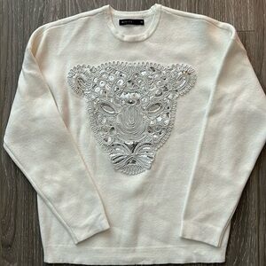 Beautiful sweater with embellishment on the chest. Size XS